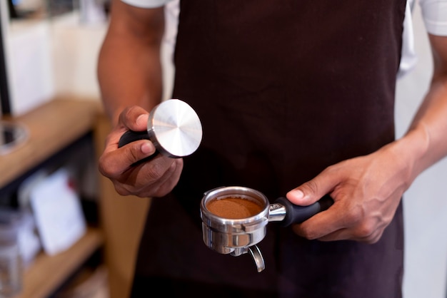 Close up hands preparing coffee