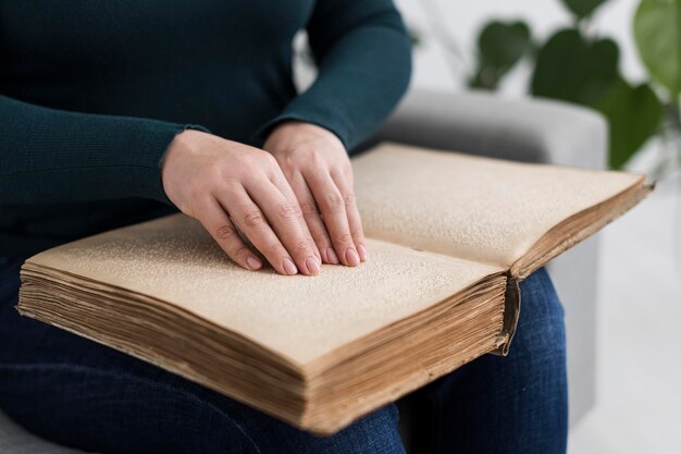 Close-up hands reading book