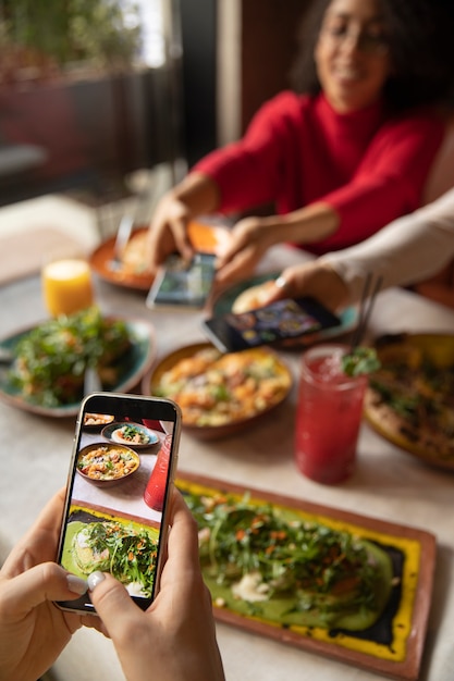 Close up hands taking food photos