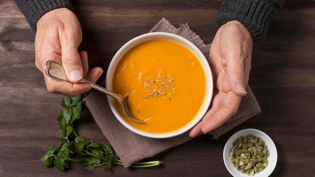 Free Photo close-up hands touching bowl