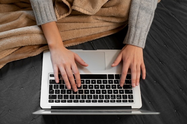 Free photo close up hands typing on keyboard