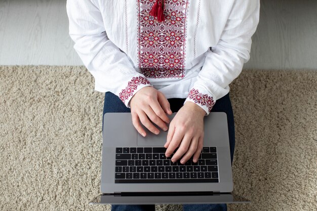 Close up hands typing on laptop