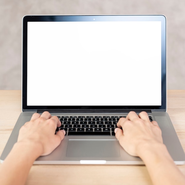 Close-up hands typing in macbook mock-up