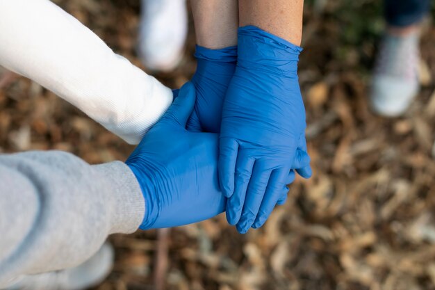 Close up hands wearing gloves