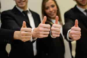 Free photo close-up of hands with thumbs up