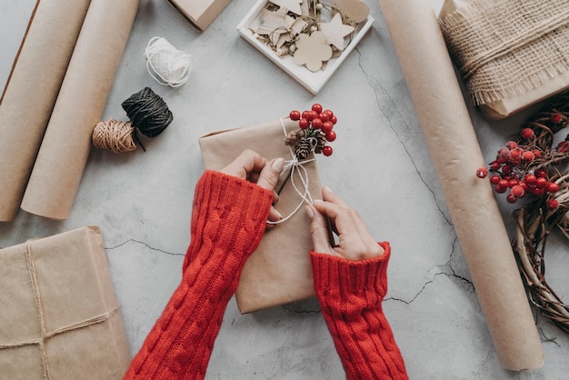 Close-up hands wrapping presents