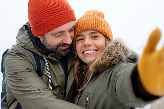 Close up happy couple taking selfie