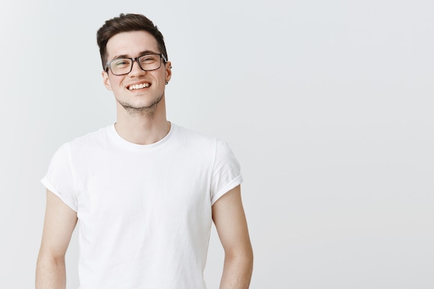 Close-up of happy smiling guy in glasses