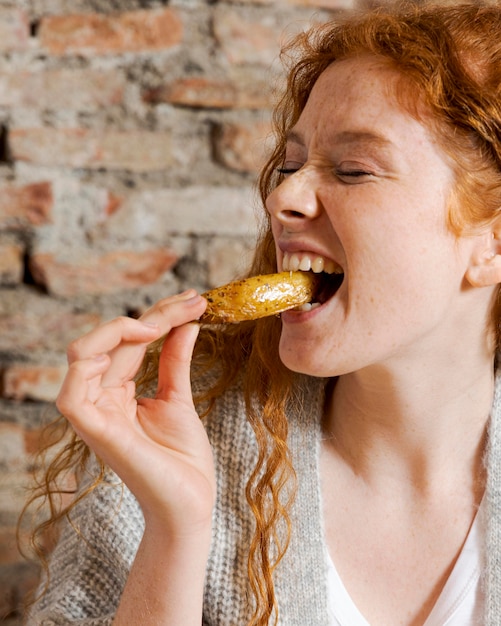 Close up happy woman eating