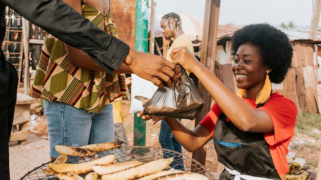 Close-up happy woman selling food