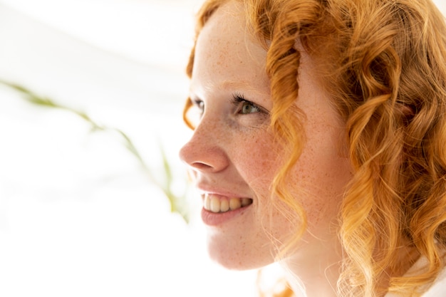 Close-up happy woman with ginger hair