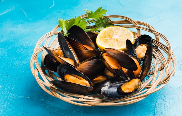 Close-up high angle view cooked mussels in basket