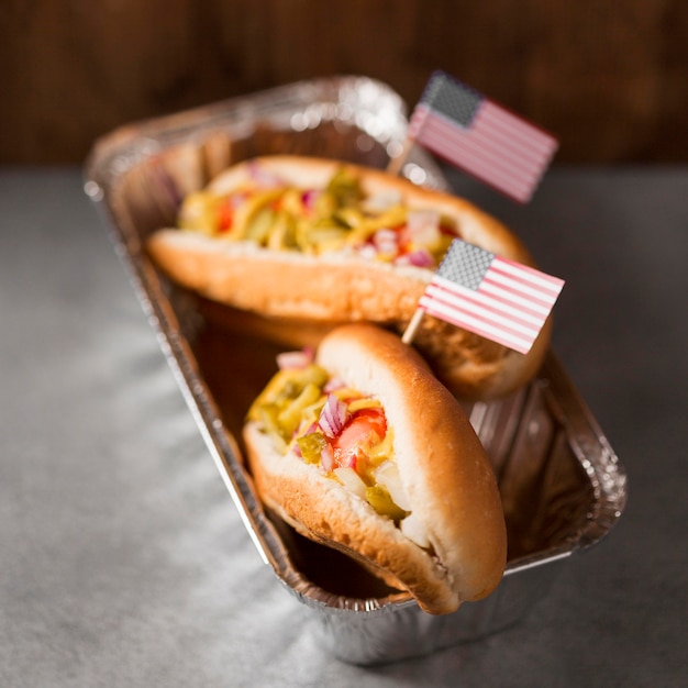 Close-up hot-dogs with american flag in tray