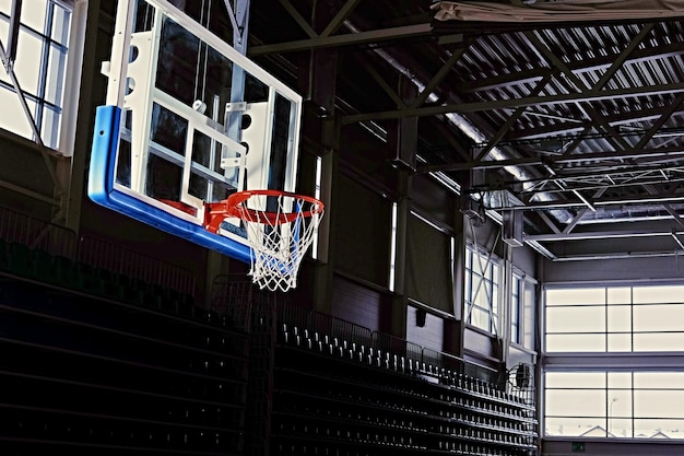 Close-up image of a basketball hoop in a game hall.