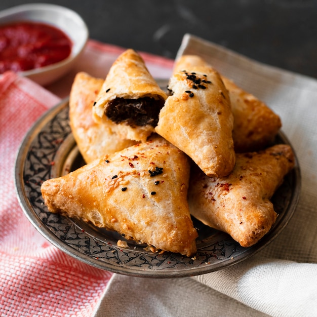 Free photo close-up indian patisserie products with chocolate