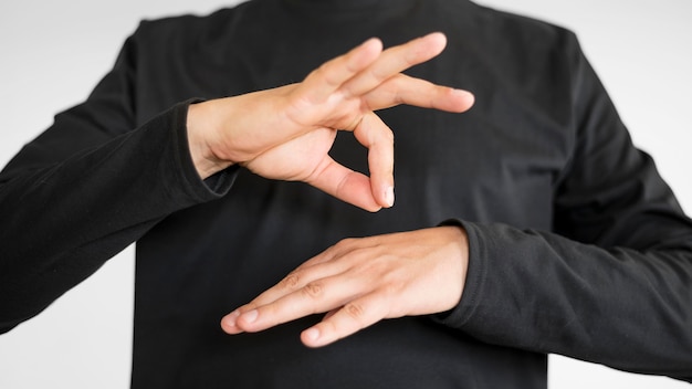 Close-up interpreter teaching sign language