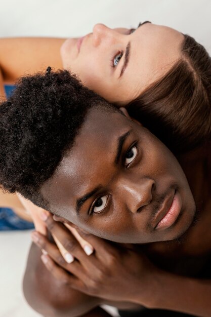 Close-up interracial couple posing