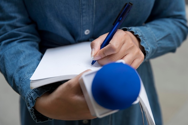 Close up on interviewee taking notes