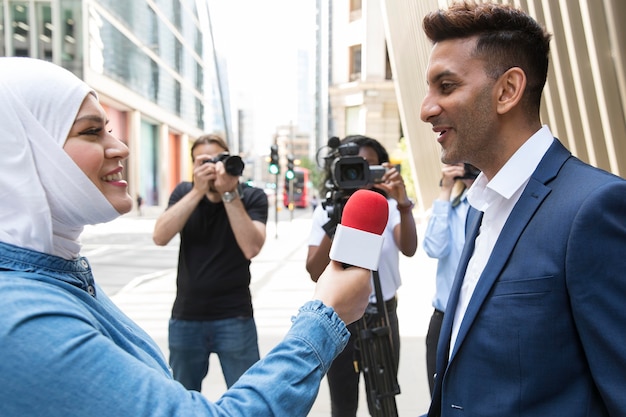 Free Photo close up on interviewee with microphone taking statements