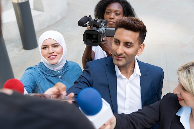 Free Photo close up on interviewee with microphone taking statements