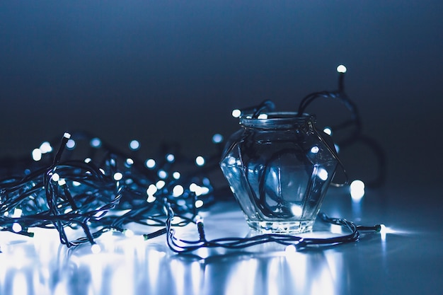 Free photo close-up jar and fairy lights