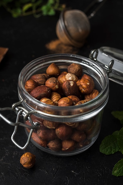 Free Photo close-up jar filled with hazelnuts