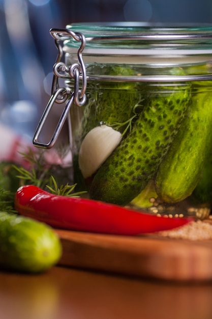 Close up of jar with pickled cucumbers
