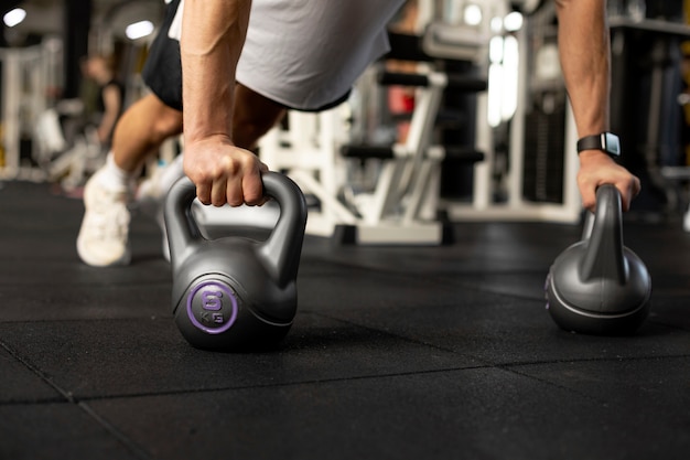 Close up kettlebells workout at gym