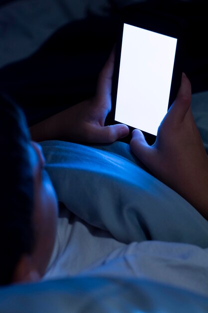 Close-up kid holding smartphone