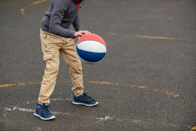 Free photo close up kid playing with ball