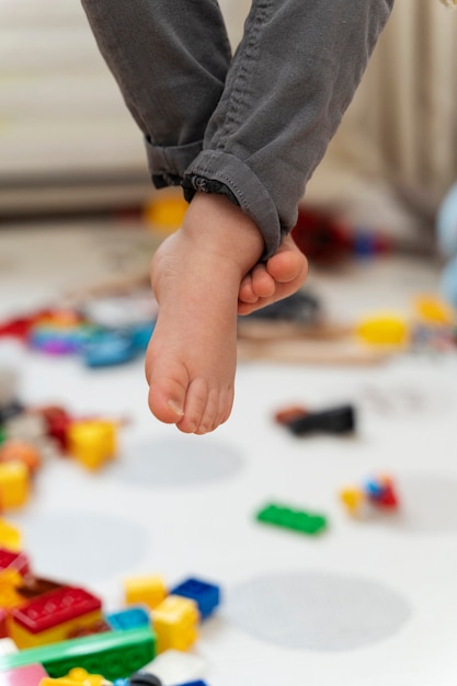 Free photo close up kid's feet with blurry background