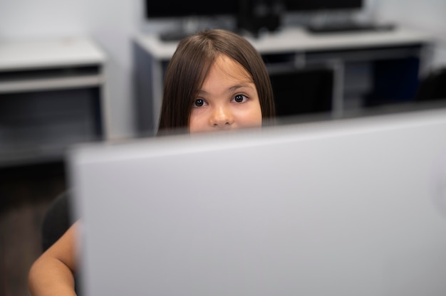 Close up on kid while having technology education class