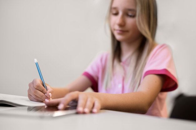 Close up on kid while having technology education class