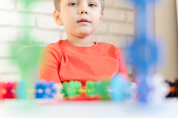 Close-up kid with floral toy