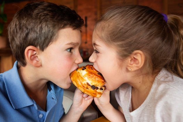 Close up kids eating dessert