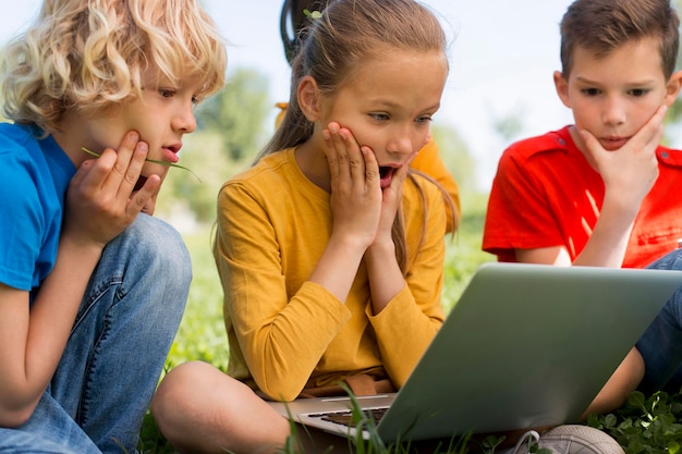 Free photo close up kids with laptop