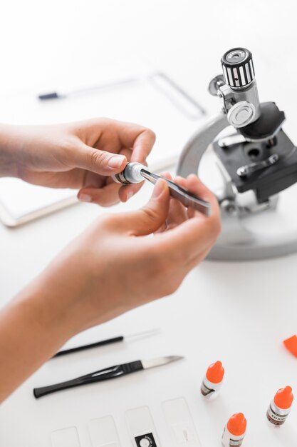 Close-up of lab technician doing experiment in lab