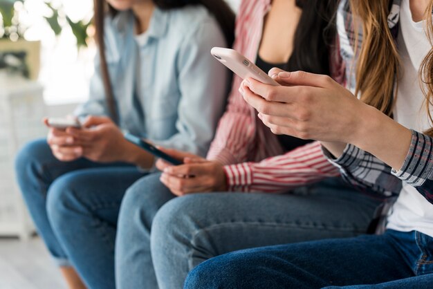 Close up of ladies hands holding phones