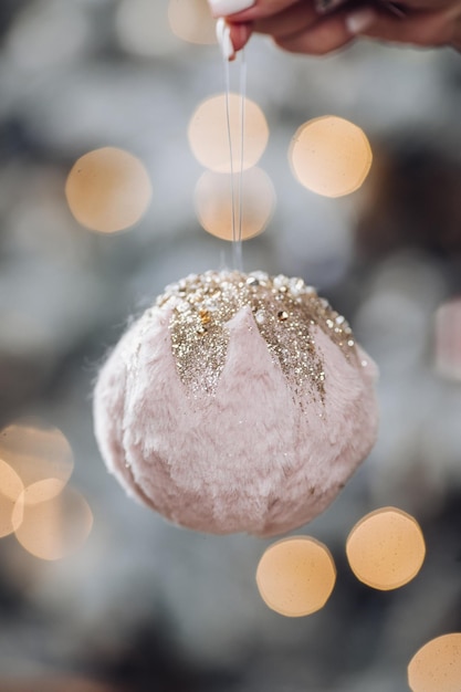 Free photo close up of lady with white new year toy. new year eve concept