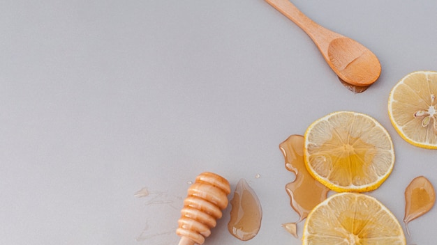 Close-up lemon slices covered in honey