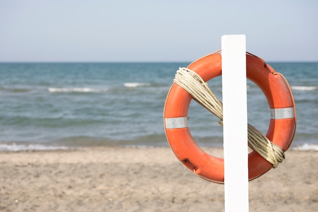 Free Photo close up lifebuoy on beach