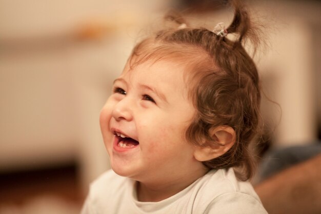 Close-up of little girl laughing