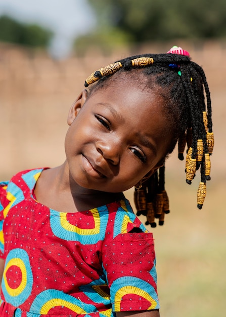 Free photo close-up little girl portrait outdoors