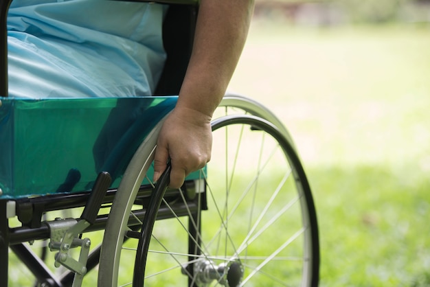 Free Photo close up lonely elderly woman sitting on wheelchair at garden in hospital