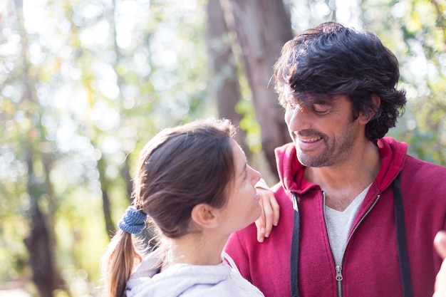 Close-up of loving woman looking at her husband in the field