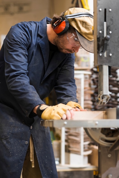 Free photo close-up of a male carpenter working with wood