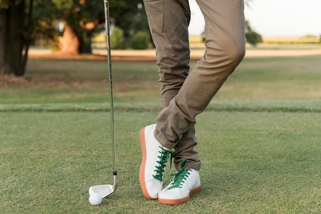 Close-up male playing golf