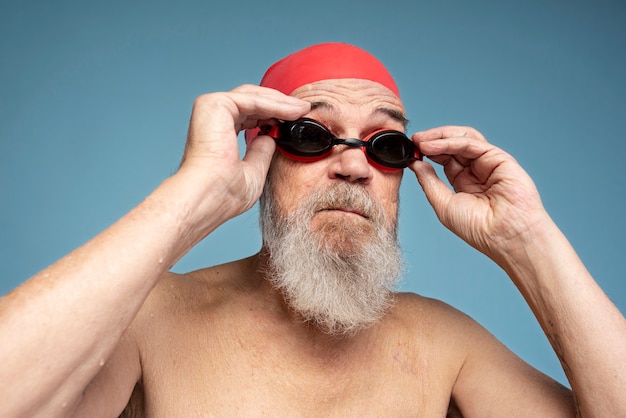 Close up man arranging goggles