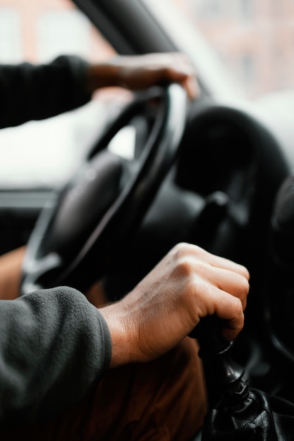 Close up man in the car driving