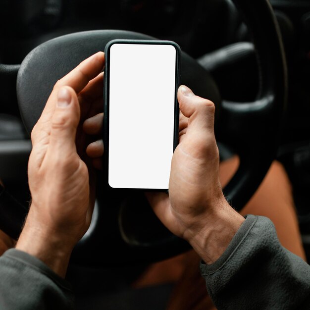 Close up man in the car with mobile